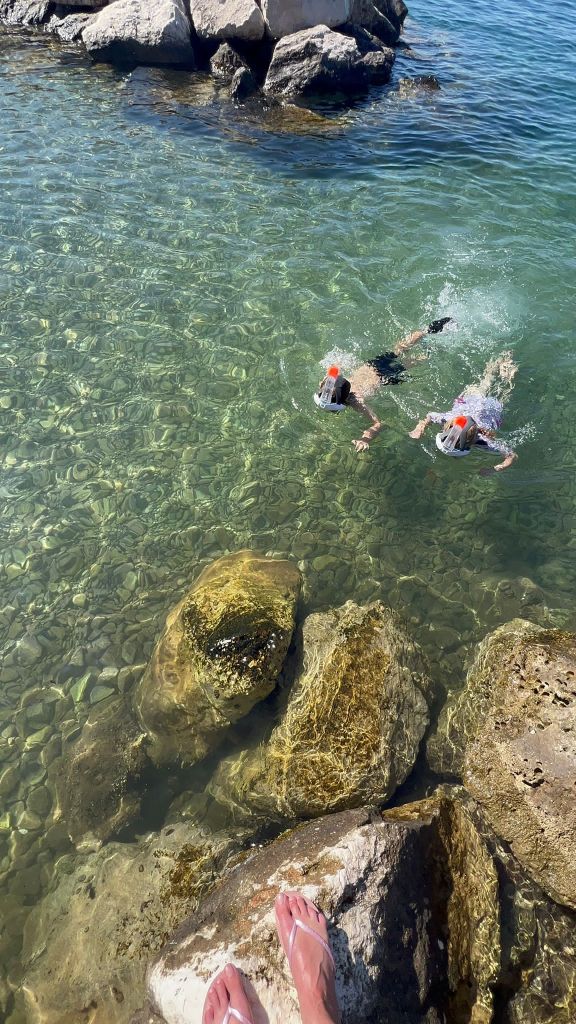 Children snorkelling in the clear sea in Croatia