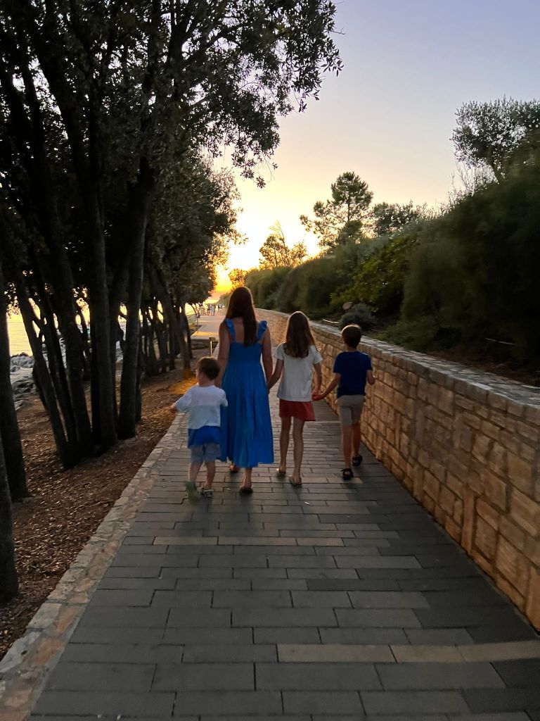 Family enjoying an evening walk near Porec at the Valamar Istra Campsite.