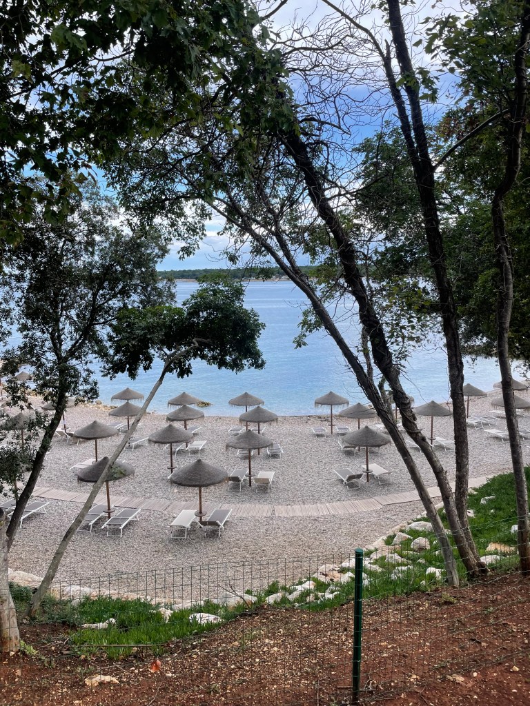 Pebble Beach with sunbeds at Istrian Luxury Campsite