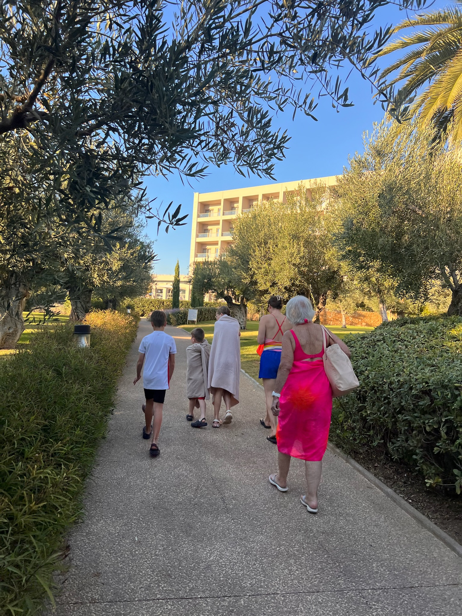 People walking on the easy accessible pathways around Ikos Olivia