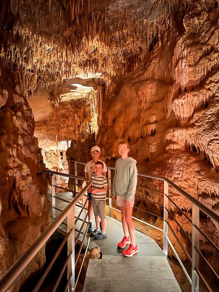 Children exploring the caves at Petranola