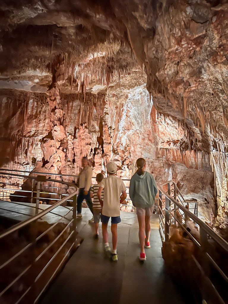 Children exploring the caves at Petranola