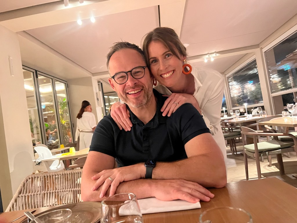 Happy couple smiling in the buffet restaurant at Ikos Olivia